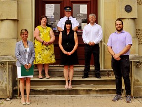 Details of Haldimand and Norfolk’s Community Safety and Well-Being Plan were shared Tuesday on the east lawn of Governor Simcoe Square. Among those on hand for the occasion include, back row up top, Insp. Rob Scott, interim chief of the Norfolk OPP; middle row from left, Heidy VanDyk, Norfolk and Haldimand’s interim general manager of health and social services, consultant Kim Shippey of Port Dover, and Norfolk operations manager Bill Cridland; and, front from left, Norfolk Mayor Kristal Chopp and Simcoe Coun. Ryan Taylor. – Monte Sonnenberg