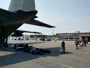 Evacuees from Poplar Hill First Nation arrive at the Kenora Airport on Friday, July 16. The city is welcoming 75 people from the community 120 kilometres north of Red Lake.