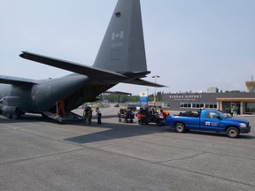 Evacuees from Poplar Hill First Nation arrive at the Kenora Airport on Friday, July 16. The city announced on July 23 that evacuees are now returning home.