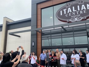 As part of the grand opening ceremony, Teresa Spinelli, owner and president of Italian Centre Shop, was joined by the staff of the new Italian Centre in Emerald Hills on Wednesday morning. Lindsay Morey/News Staff
