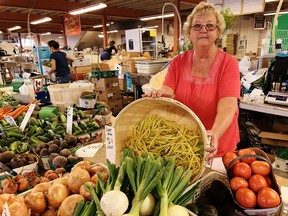 Joan Bowman of Bowman’s Produce, a vendor at the Simcoe Farmers Market, said Thursday that local fruits and vegetables would benefit from a prolonged spell of sunny, dry weather. Excessive rainfall so far this summer coupled with cloudy skies and cool nights is creating challenges for farmers in Norfolk County and elsewhere.