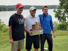 Idylwylde Men's Invitational winner Don Martone poses for a photo between tournament chair Robbie Coe, left, and Idylwylde Golf and Country Club pro David Bower in Sudbury, Ontario on Monday, July 26, 2021. Randy Pascal/For The Sudbury Star