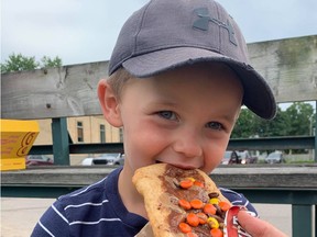 Hayden Houston, with his family, were excited to try Beaver Tails on Friday, July 16 at a fundraising event for the Ripley Agricultural Society, Hannah MacLeod/Lucknow Sentinel
