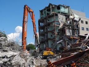 Demolition of the St. Vincent de Paul Hospital continues and is scheduled to be finished next month. Wayne Lowrie/Recorder and Times