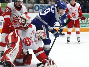 Landon McCallum, right, of the Sudbury Wolves, looks for a rebound in front of goalie Nick Malik, of the Soo Greyhounds, during OHL action at the Sudbury Community Arena in Sudbury, Ont. on Friday March 6, 2020.