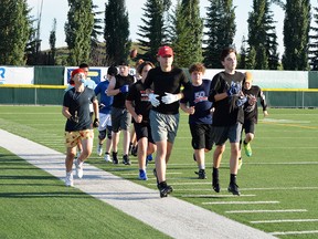 Members of the Spruce Grove and District Minor Football Association (SGDMFA) Bantam team hit the field at Fuhr Sports Park on Thursday, Jul. 22, 2021, for agility practice camp. Photo by Kristine Jean/Postmedia Network.