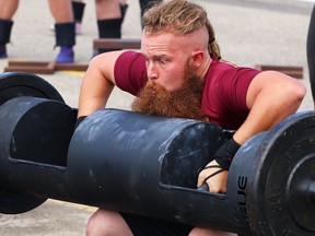 Phil Giroux competes during the men's lightweght log lift during Spruce Grove's Strongest at the Tri-Leisure Centre in Spruce Grove on Saturday, Aug. 24, 2019. Photo by Josh Aldrich/Postmedia.