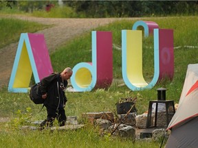 A camp of about 10 tents that has been set up on the south bank of the North Saskatchewan River in ᐄᓃᐤ (ÎNÎW) River Lot 11∞ Indigenous art park, within Queen Elizabeth Park, on Thursday, July 15, 2021.