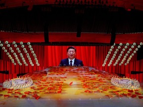A giant screen shows Chinese President Xi Jinping during a show commemorating the 100th anniversary of the founding of the Communist Party of China at the National Stadium in Beijing on Monday. The victors write history, Gwynne Dyer notes, but he doubts the Communist Party really has much to brag about. (Thomas Peter/Reuters)