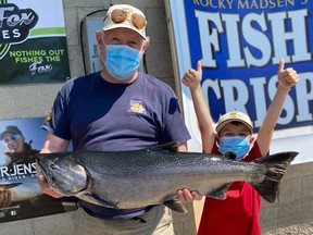 As of Tuesday morning, Bob McLean of Monkton, Ont., led the way in the Lake Huron Fishing Club's Chantry Chinook Classic Salmon Derby with a 17.39-pound chinook salmon. McLean posed with the leading salmon and his grandson by his side Tuesday morning. Over 1,000 anglers will try their luck in Lake Huron and Georgian Bay this week with the derby closing Monday at 2 p.m. Photo supplied.