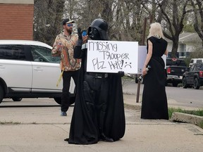 Darth Vader stands outside Coco Vanilla Galactic Cantina in Lethbridge after local police handcuffed and arrest a teenage employee dressed as an Imperial Stormtrooper with a plastic toy gun.