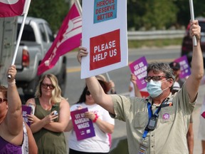 Dozens of CUPE members rallied outside of the LWDH, prompting dozens more to honk their horns in support.