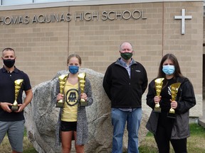 From left: teacher Jeff Sachowski, Maddyn Hughes, teacher James Trudeau and Tieryn Hall, holding their trophies for the many categories they won at the festival.