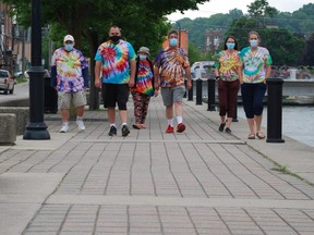 Members of Union Place's Street Beats group walk along the east side of the Owen Sound harbour this week. From left to right are: Charles Coke, James Kowalski, Pat Reain and John Thompsett, along with CMHA employees April Torrie and Dawn Concordia. DENIS LANGLOIS