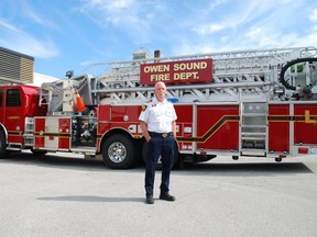 Chief Doug Barfoot stands in front of one of Owen Sound Fire & Emergency Services' fire trucks Monday at the city fire hall on 3rd Avenue East. Barfoot has announced he will be retiring once a new chief has been found. DENIS LANGLOIS
