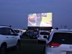 More than 200 members of the London Aquatic Club gathered at the Oxford Drive-In to watch clubmate Maggie Mac Neil win women’s 100-metre butterfly gold at the Tokyo Olympics. (MEGAN STACEY/The London Free Press)