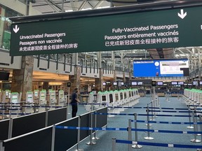 Segregated line-ups for vaccinated and unvaccinated international arrivals at Vancouver International Airport