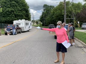 Protesters at Saturday's 'Golf Bag protest' at the closed Arrowdale golf course handed out flyers and spoke of their continued determination to stop the sale, which has not yet been finalized.