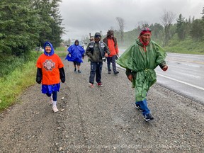 Chief Vern Janvier and supporters on the third day of a 500-kilometre walk from Sudbury to Ottawa that began on July 18, 2021. Supplied Image/Joey Podlubny