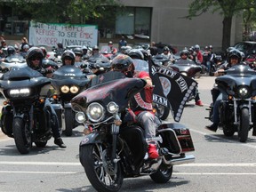 A convoy of motorcycles leaves Elgin-Middlesex Detention Centre, where nearly 1,000 people gathered to protest the death of inmates Saturday, July 17, after the funeral of Brandon Marchant, the latest inmate to die at the London jail. (Dale Carruthers/The London Free Press)