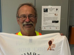 Denis Larocque shows off one of the tshirts designed for this year's Jim Walsh Bike Ride for Kids with Cancer, featuring the face of Walsh, a major community fundraiser who died in 2012.
