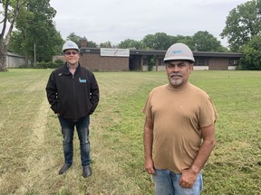 Nathan Lancaster (left) president of Lanca Contracting and Mukesh Grover, in front of the former Burford elementary school on Maple Avenue.