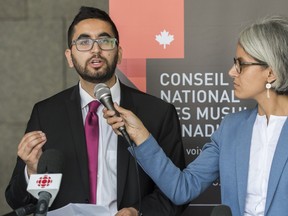 Members of the National Council of Canadian Muslims Mustafa Farooq, left, and Bochra Mana speak during a news conference in Montreal, Monday, June 17, 2019. Farooq, said Canada needs to overhaul its hate crime legislation. But he said any changes need to strike the right balance to avoid impacting marginalized groups.