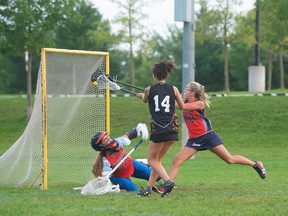 Owen Sound North Stars under-15 A field lacrosse players Aliyah Bonterre (No. 14) shoots on Kawartha's goalie during Saturday afternoon field lacrosse action at Halton Hills. Photo supplied by Allison Davies.