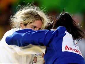 Canada's Priscilla Gagne, left, of Sarnia, Ont., battles Uzbekistan's Sevinch Salaeva during women's judo at Rio Olympic Arena at the Rio Paralympics in Rio de Janeiro, Brazil,  on Thursday September 8, 2016. Leah Hennel/Postmedia