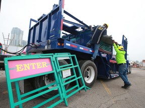 Crews begin the clean up and tear down after the 2021 Calgary Stampede on Monday, July 19, 2021.