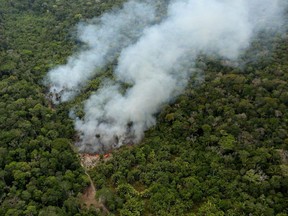 FILE PHOTO: An aerial view shows a fire in an area of the Amazon rainforest near Porto Velho, Rondonia State, Brazil, September 10, 2019. REUTERS/Bruno Kelly TPX IMAGES OF THE DAY/File Photo ORG XMIT: FW1