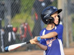 Boston Bambrough of the Mitchell Major Rookie Tier 2 U9 baseball team prepares to take a swing at an oncoming pitch during action with visiting Exeter July 14 at Keterson Park. The Astros fared well for their first game of the season, pulling out a narrow victory. ANDY BADER/MITCHELL ADVOCATE