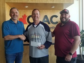 Randy Klassen, CLAC regional director (from left to right), Jack Lumley, volunteer at The Airdrie 100, and Wayne Lodge, CLAC member pose for a celebratory photo after CLAC delivered a $2,500 donation to 100 Airdrie Men Who Give A Damn.