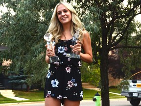 Amelia Prior shows off a couple of trophies that she has won in her time as a competitive dancer. Prior is preparing to attend Harbour Dance Centre to persue a future career in show business. Photo by Riley Cassidy