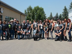 Members of Against All Abuse and Airdrie POWER gather for a group photo to celebrate the successful fundraiser at East Coast Pub and Eatery on July 17.