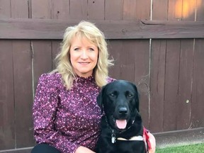 Deb Reid and Jake the support dog (pictured) earned the Alberta Community Justice Award for their outstanding work with victims of crime and trauma, both in the courthouse and out in the community. Photo courtesy of Deb Reid