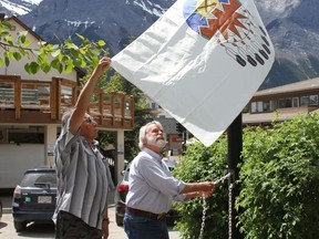 Canmore Mayor John Borrowman, and the late Tribal Historian, Buddy Wesley, from Stony Nakoda, raised the Treaty 7 flag outside the Civic Center in Canmore to celebrate unique heritage and diverse cultures of the nation's aboriginal peoples on June 21, 2020. Photo Marie Conboy/ Postmedia.