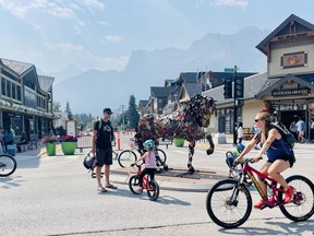 Smokey skyline in downtown Canmore on July 25 as local businesses gear up to welcome back American tourists on Aug. 9. Photo Marie Conboy/ Postmedia.