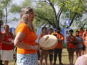 Mary Ann Spencer leads a drumming and singing session for the Tyendinaga Respectful Voices for Change event at West Zwick's Park Thursday morning. BRUCE BELL