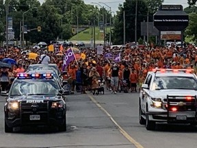 Thousands of people on Thursday join a Unity Walk in Brantford from the civic centre to the former Mohawk Institute residential school. Susan Gamble