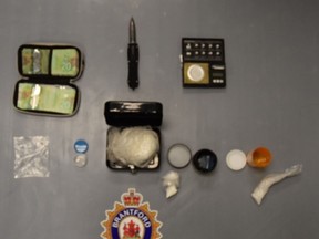 Brantford police say they seized drugs and a prohibited weapon after a search at a Colborne Street motel.