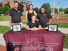 Pauline Johnson Collegiate graduate Toren Burr has accepted a scholarship to attend NCAA Division I University of Maryland, Baltimore County, where he'll throw javelin for the school's track and field team. With Burr are coaches Trevor Windle (left), Vicki Webb and Sean Doucette.