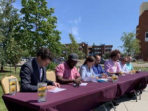 Grande Prairie Councillor Dylan Bressey (far left) signs the Alberta Urban Municipalities Association pledge, that is designed to eliminate rancour in politics.