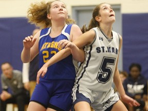 Charlotte Morrison (left) and Grace Kelly are on the court during an Athens-St. Mary junior girls high school basketball game in October 2019. Sports as well as extra-curricular activities are set to resume in the upcoming school year. Four consecutive high school seasons have been cancelled since COVID-19 was deemed a pandemic in March 2020.
File photo/The Recorder and Times