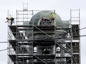 Workers with Northstar Access near the completion of a scaffold around Brockville's city hall clock tower on Wednesday, July 7. (RONALD ZAJAC/The Recorder and Times)