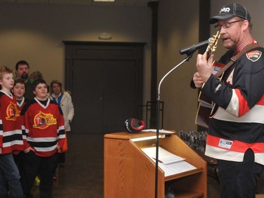 Randy Hopkins, one of the leaders of the Kids Christian Hockey League, leads the crowd in Stompin' Tom Connors' "The Hockey Song," a tradition at end-of-season meetings, in 2015.
File photo/The Recorder and Times