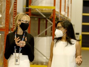 Penny Wise, left, 3M Canada's president and managing director, speaks to federal Procurement Minister Anita Anand at the company's N95 mask plant in Brockville on Tuesday afternoon. (RONALD ZAJAC/The Recorder and Times)