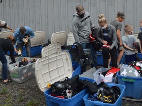 There was a good turnout at Matt's Auto Service in Brockville on Tuesday for the first evening of a hockey equipment giveaway by the Kids Christian Hockey League. The second and final evening is set for Thursday from 6 to 8 p.m. Donations to Making Play Possible will be accepted.
Tim Ruhnke/The Recorder and Times