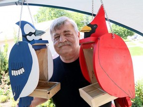 Rick Smolders of Rick's Workshop shows his bird feeders during Discover Art Blenheim in Blenheim on July 17. Mark Malone/Postmedia Network