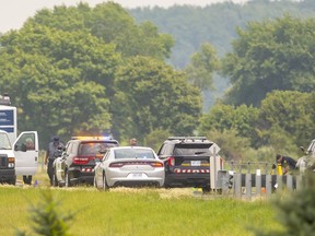 A section of Highway 401 east of Chatham was closed July 7, 2021, while the province's Special Investigations Unit gathered evidence at the scene where a man was shot by an OPP officer. The man, whose identity has not been released, died later in hospital. The province's Special Investigations Unit said Friday Chatham-Kent OPP Const. Sean O’Rourke is charged with manslaughter and criminal negligence causing death in the man's death. (Mike Hensen/The London Free Press)(Mike Hensen/Postmedia Network)